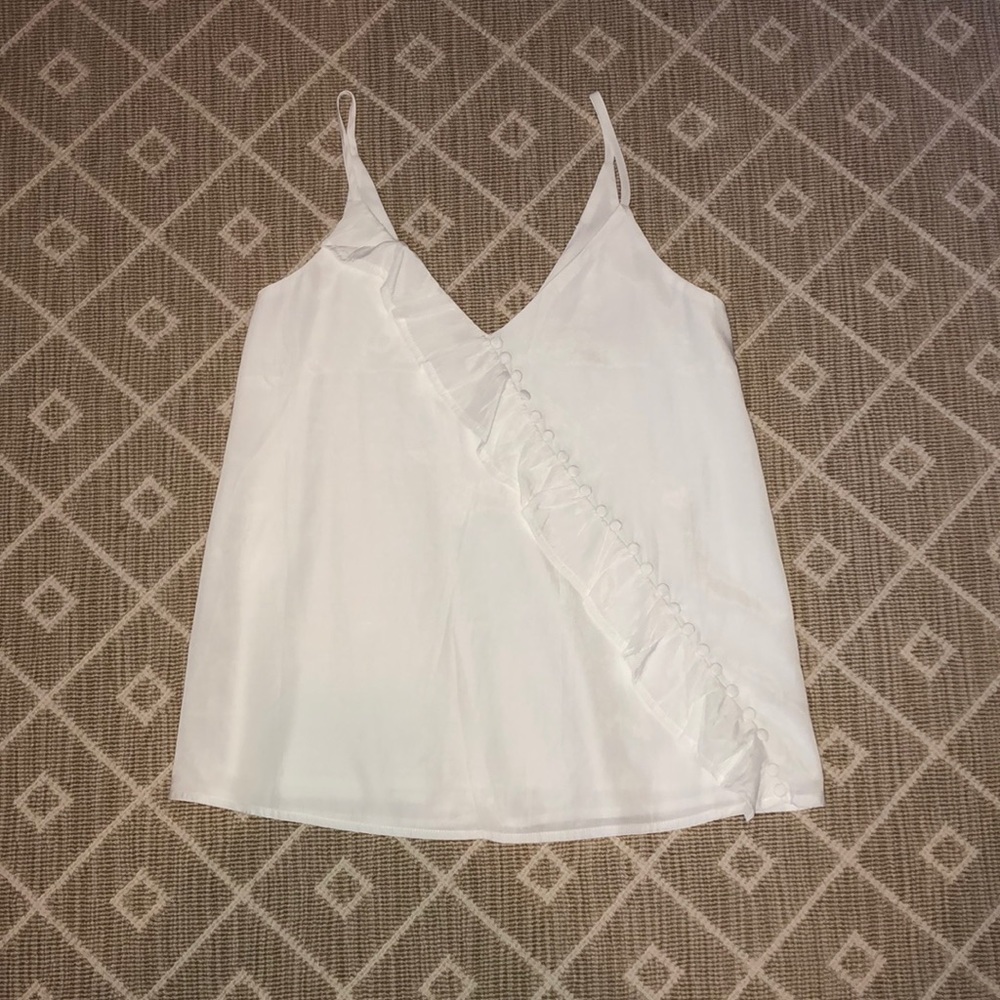 White Revolve Pom Pom top
